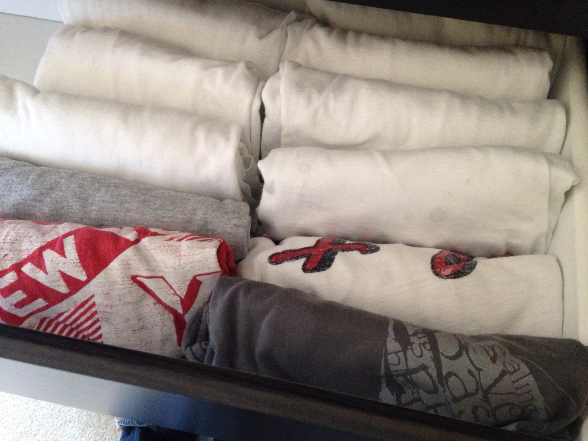 t-shirts filed in drawer folded using the Marie Kondo method