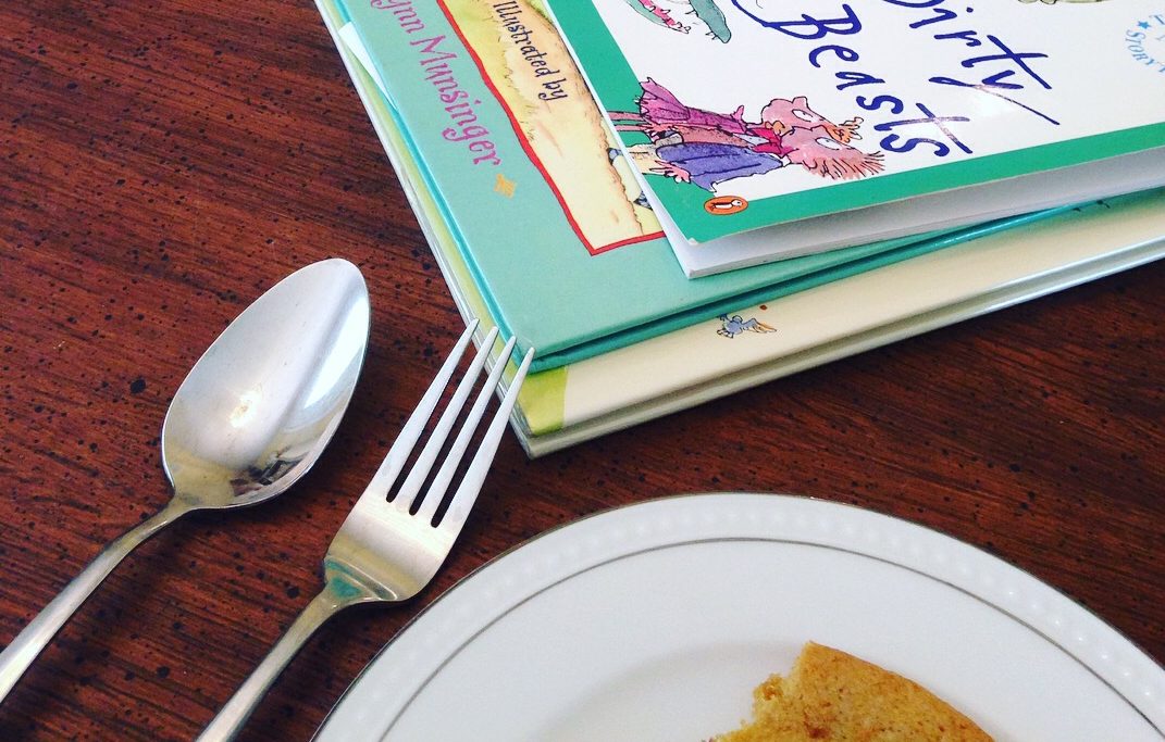 close up of children's poetry books and silverware and treats
