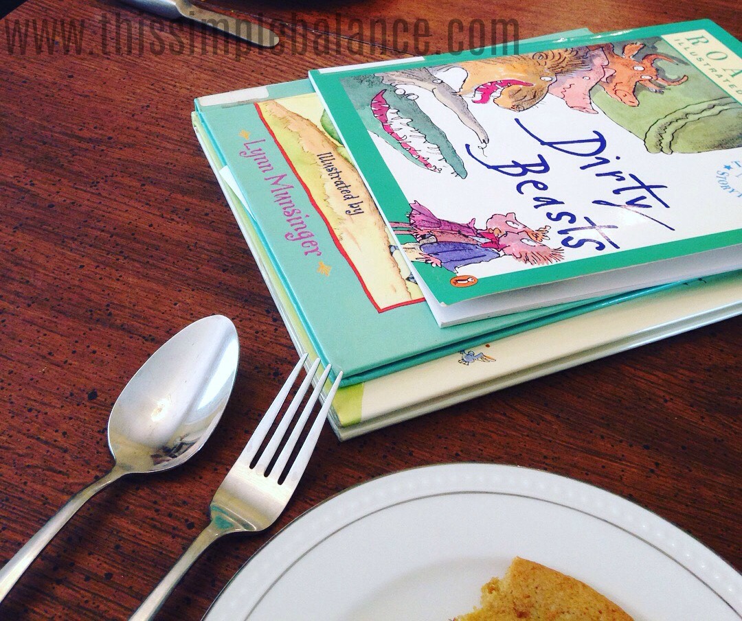 poetry books on table including Roald Dahl's Dirty Beasts, with fork, spoon and plate