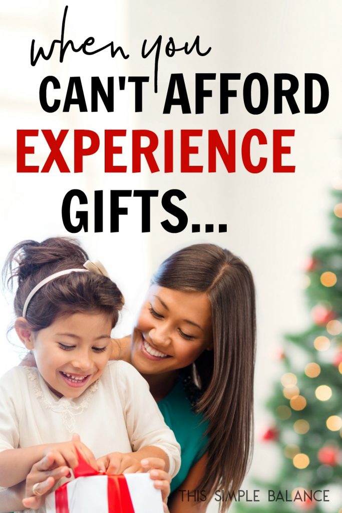 mom hugging daughter while she opens Christmas gift, Christmas tree in background, with text overlay "when you can't afford experience gifts..."