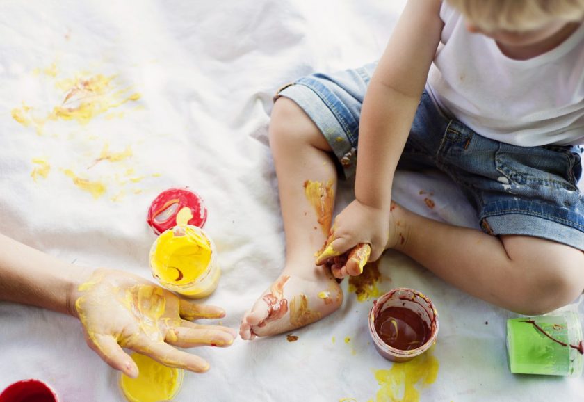 toddler and mom playing with finger paints