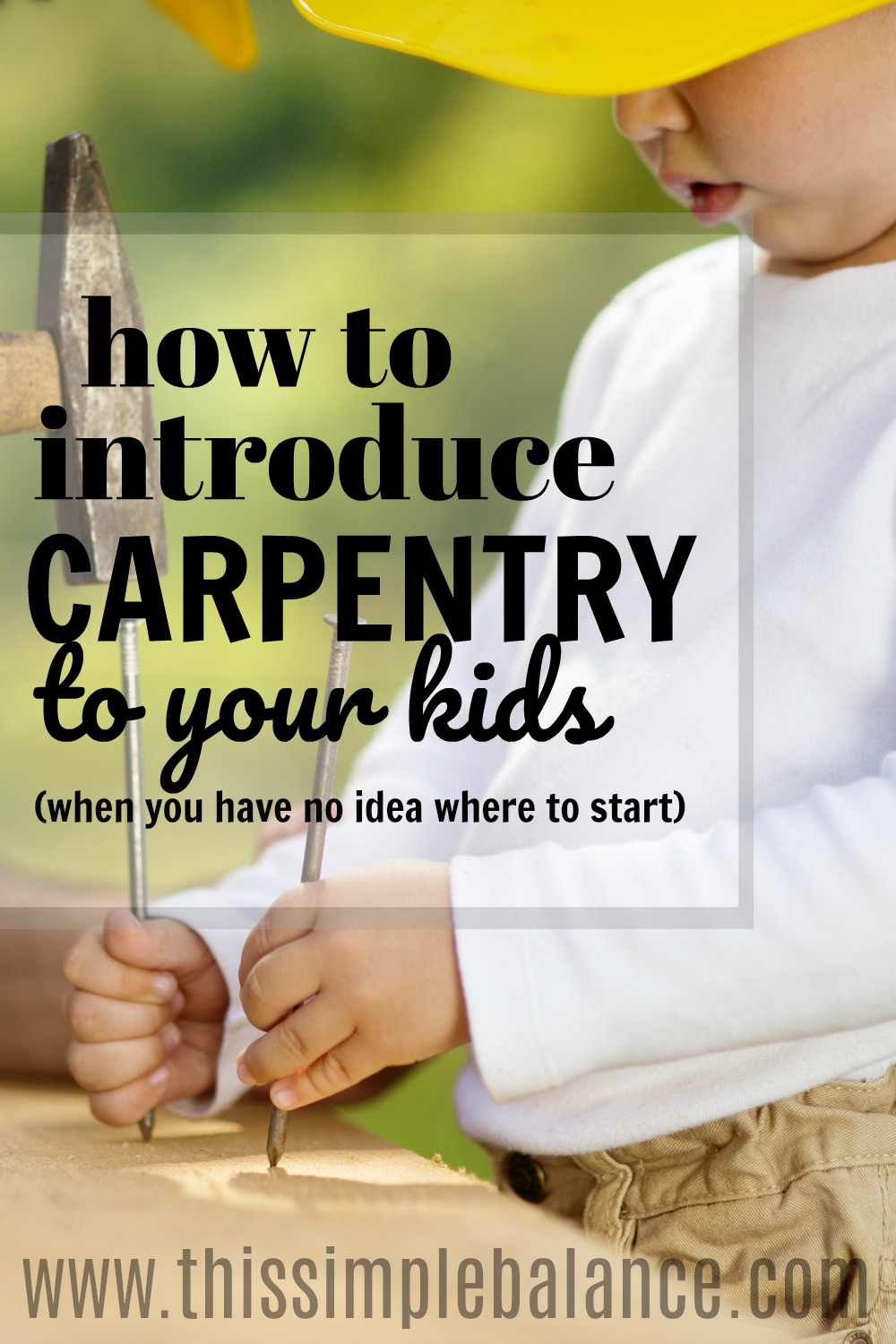 close up of young boy with yellow hard hat, holding nails on wood to be hammered, with text overlay "how to introduce carpentry to your kids (when you have no idea where to start)"