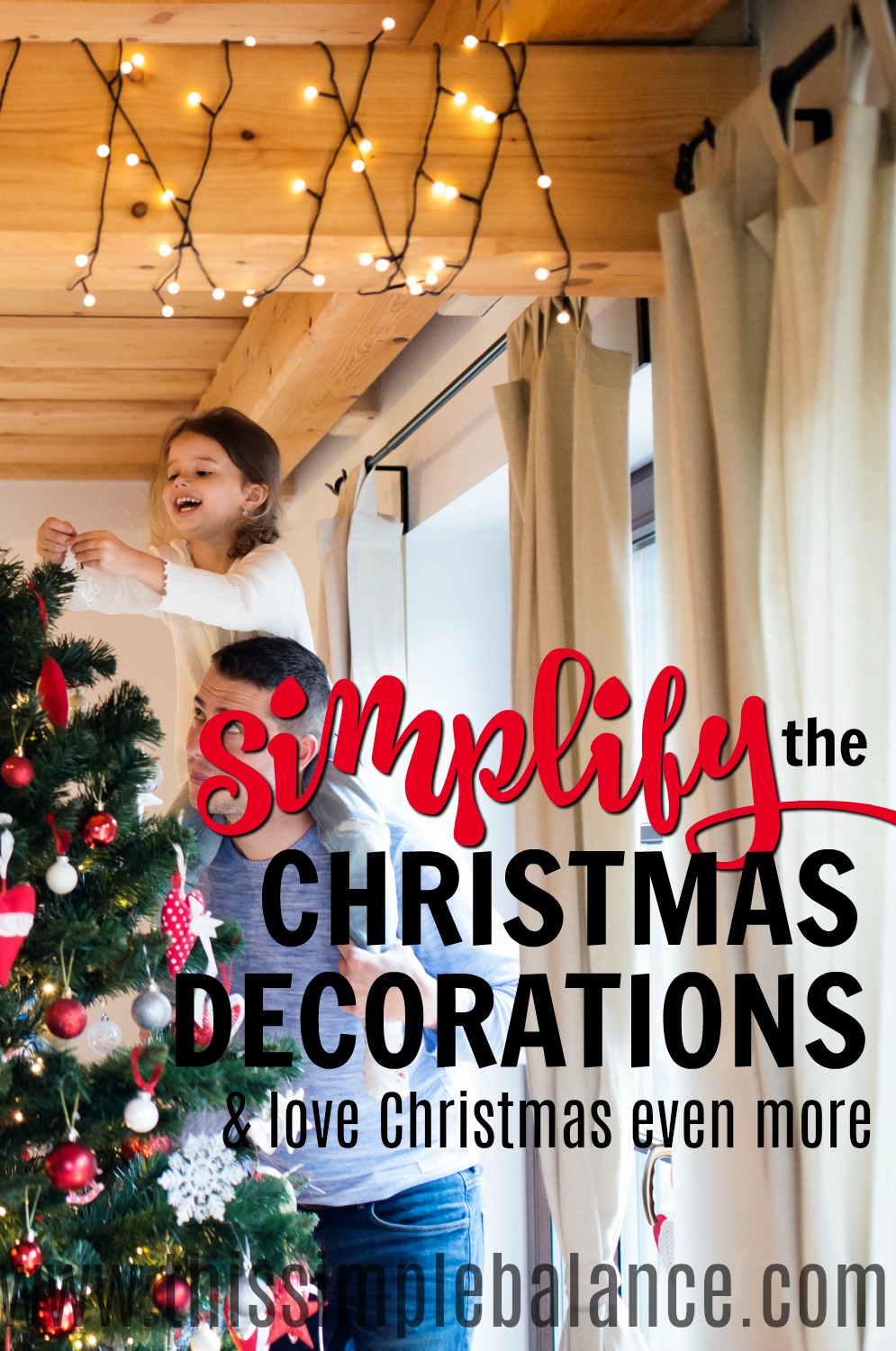 young girl putting ornament on tree, beam with white Christmas lights, with text overlay, "simplify the christmas decorations, love christmas even more"
