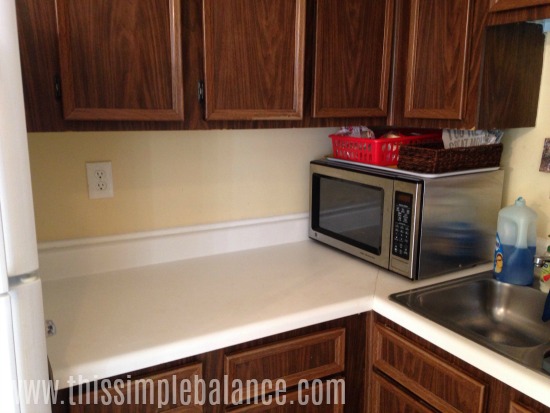 white kitchen countertop with only microwave