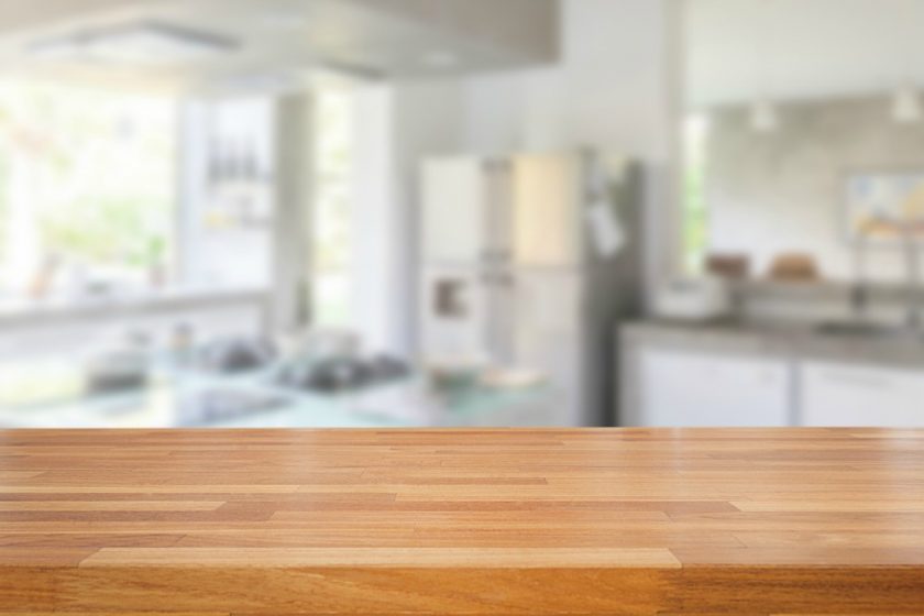 decluttered wooden kitchen countertop with nothing on it