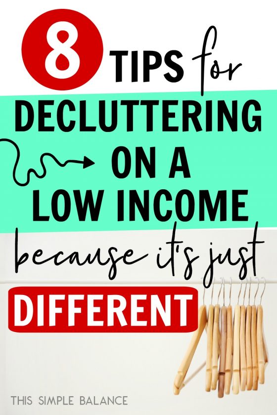 empty wooden hangers on rack, with text overlay, "8 tips for decluttering on a low income because it's just different"