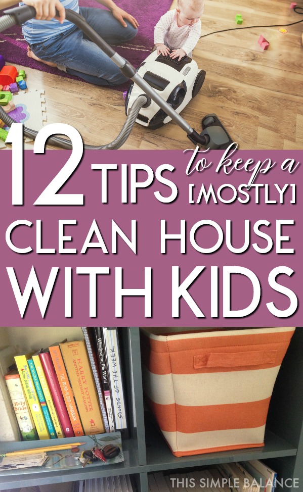 dad trying to vacuum and keep a clean house with toddler trying to climb on vacuum, living room scattered with toys, with text overlay, "12 tips to keep a mostly clean house with kids"