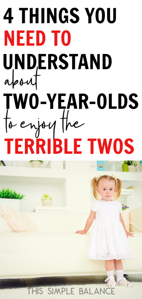 solemn two year old girl in white dress standing with back to white couch, with text overlay, "4 things you need to understand about two-year-olds to enjoy the terrible twos"