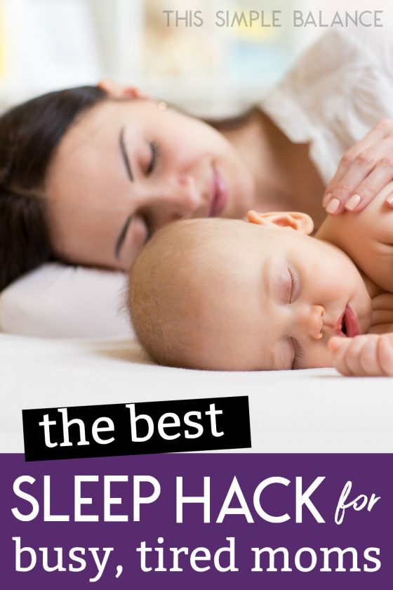 mom co-sleeping next to baby, her hand on his shoulder, with text overlay, "the best sleep hack for busy, tired moms"