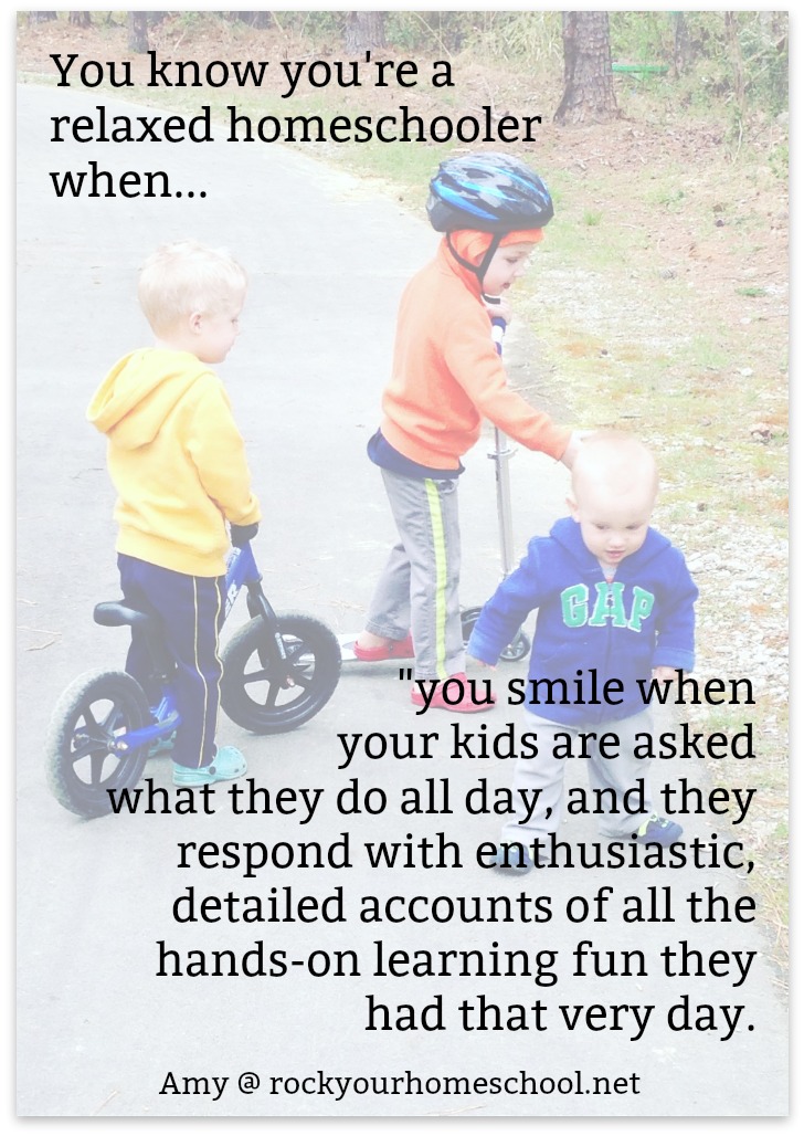 three brothers riding bikes and scooters together, with text overlay, "You know you're a relaxed homeschooler when you smile when your kids are asked what they do all day, and they respond with enthusiastic, detailed accounts of all the hands-on learning fun they had that very day."