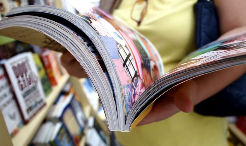 mom flipping through new homeschool curriculum book