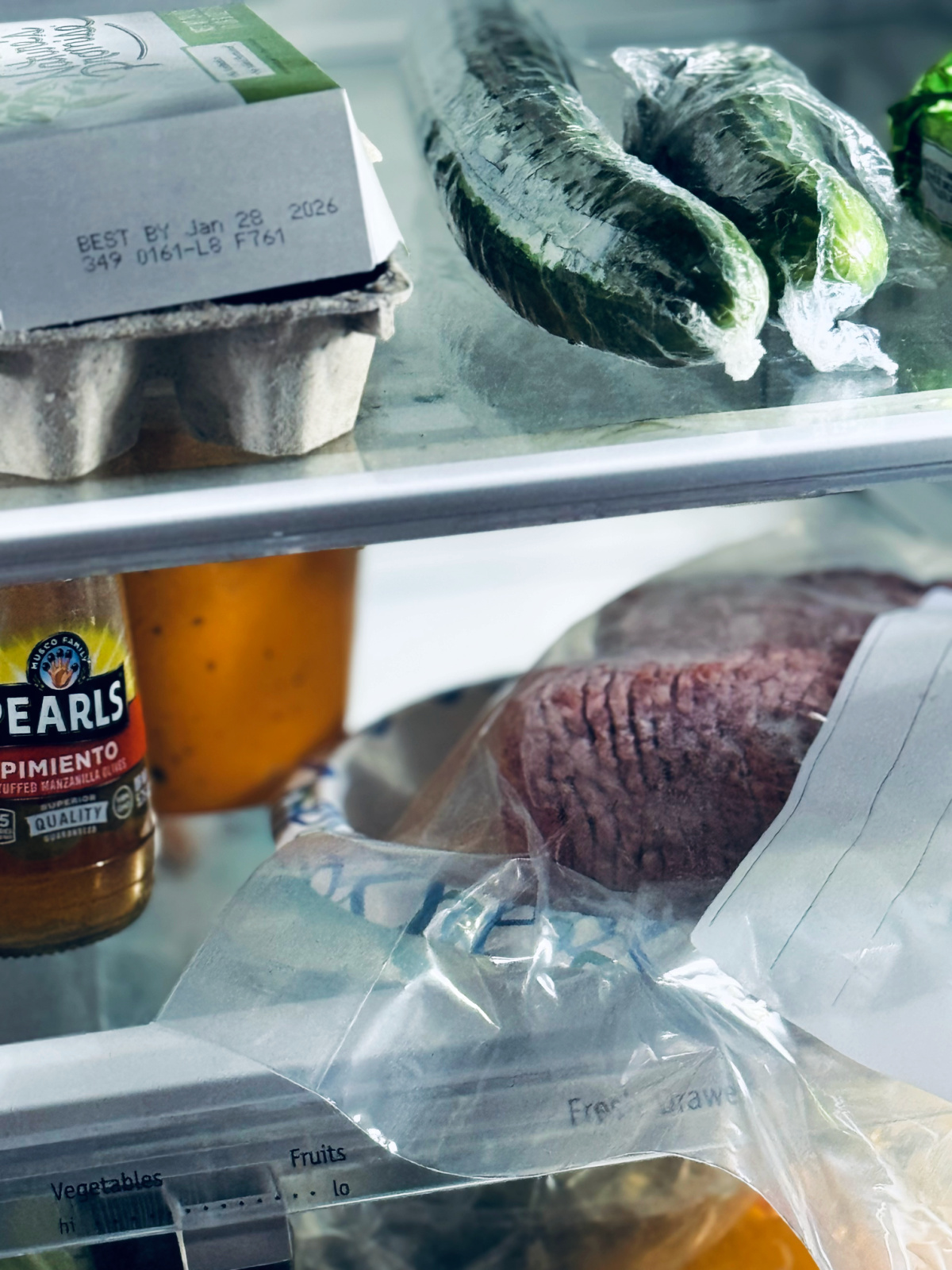 frozen meat thawing in the refrigerator for minimalist meal plan.
