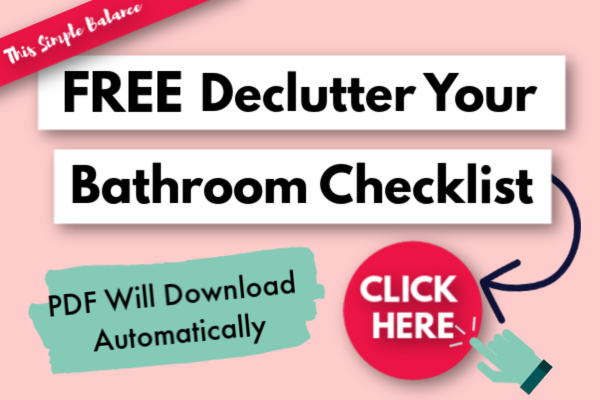 pink and blue text graphic, "Click here for a Free Declutter Your Bathroom Checklist - PDF Will Download Automatically"