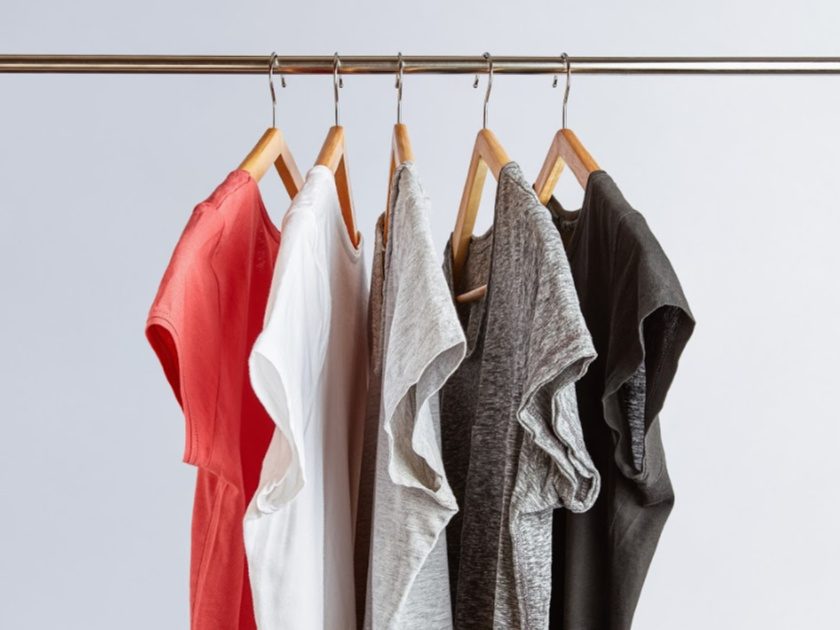 stay at home mom wardrobe example, five simple t-shirts hanging on rack