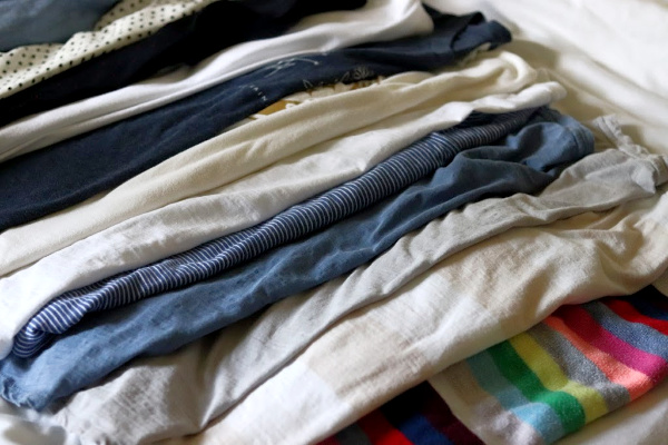 more fall capsule wardrobe tops, mostly blue, white and grey with one multi-colored striped sweater