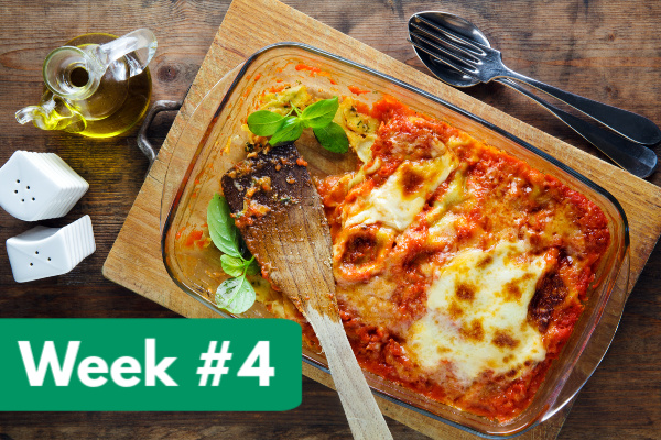 lasagna in glass dish on cutting board with white salt and pepper shakers, with text overlay, "week #4"