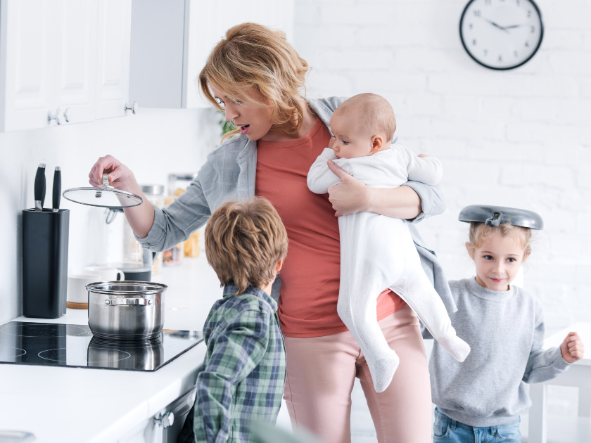 mom trying to cook and keep kids busy