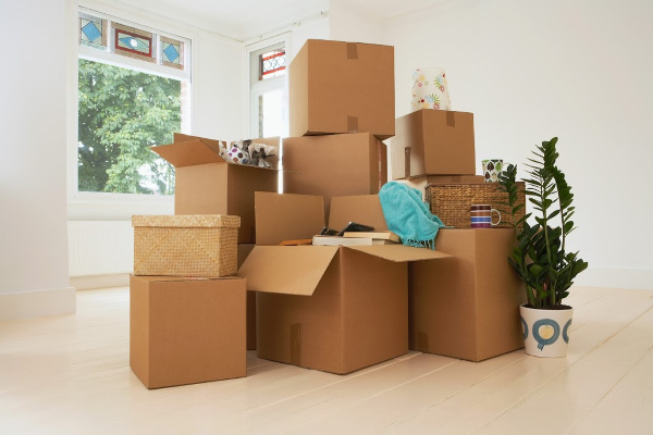 cardboard boxes stacked, moving or decluttering concept