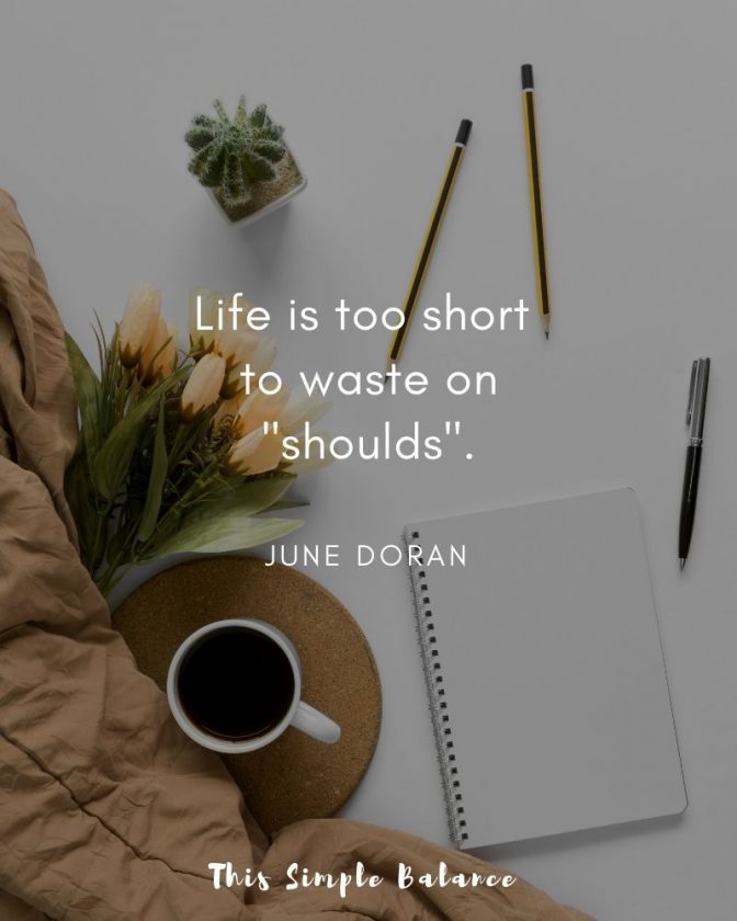 flatlay with blank journal, pen, coffee, flowers and brown throw blanket, with text overlay, "Life is too short to waste on shoulds" - June Doran