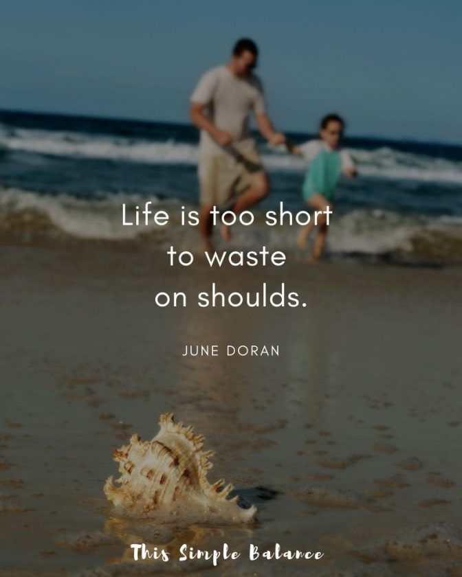 father with child at the beach with text overlay, "Life is too short to waste on shoulds. June Doran"
