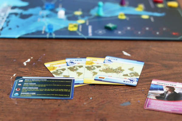 Pandemic board game and cards on table