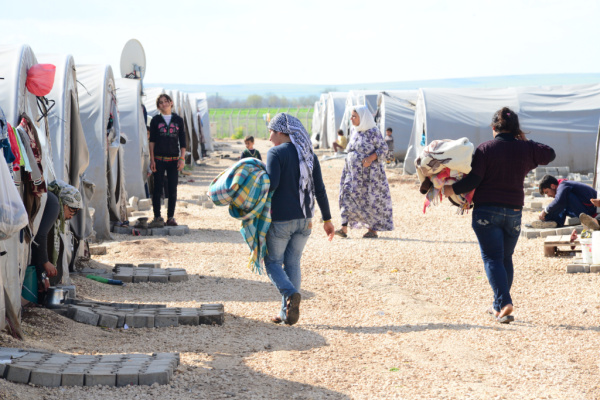 refugees walking in refugee camp