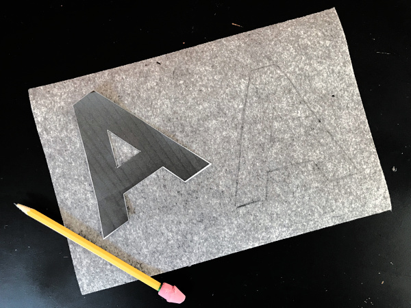 traced letter A on gray felt rectangle