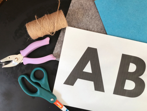 supplies for DIY alphabet banner on table