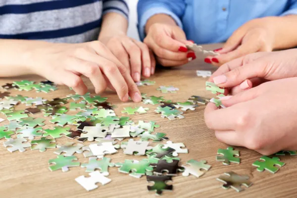 family doing puzzle together