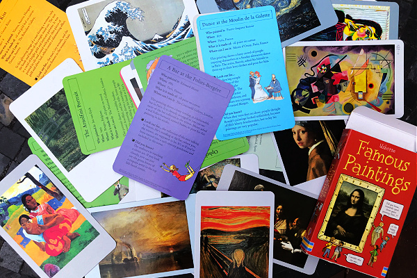 Usborne famous painting cards spread out on table