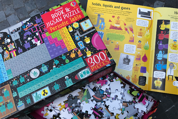 Usborne periodic table jigsaw puzzle and book, cover of the box with page of accompanying book