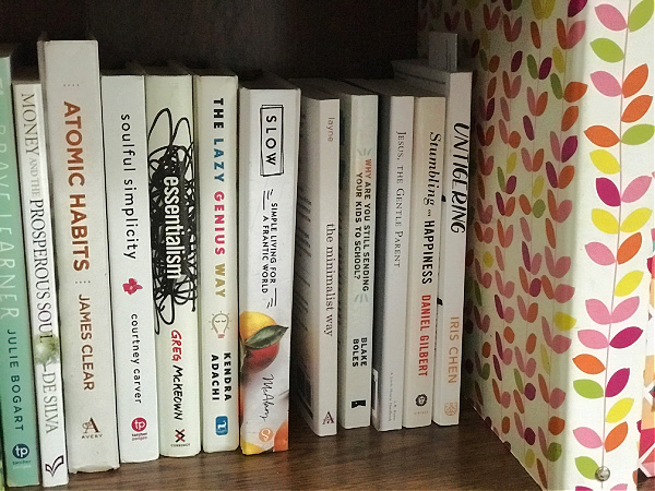 white minimalist books on bookshelf