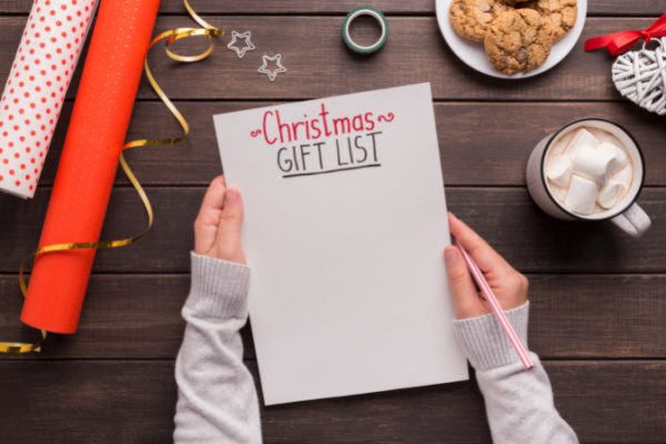 minimalist mom writing christmas gift wish list