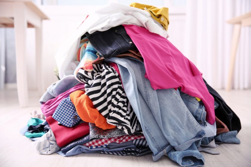 messy pile of colorful clothing on the floor