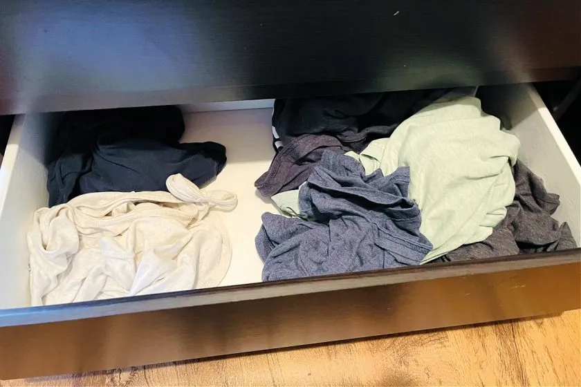 unfolded clothes in dresser drawer