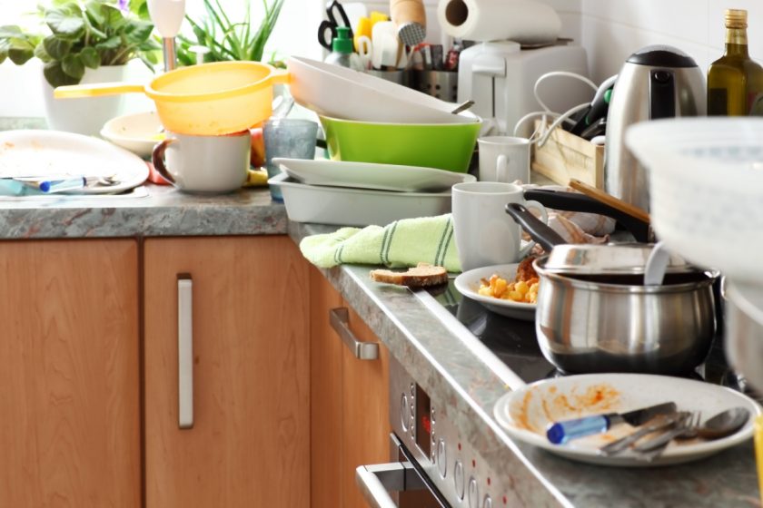 messy kitchen with dirty dishes on counter in homeschool family home