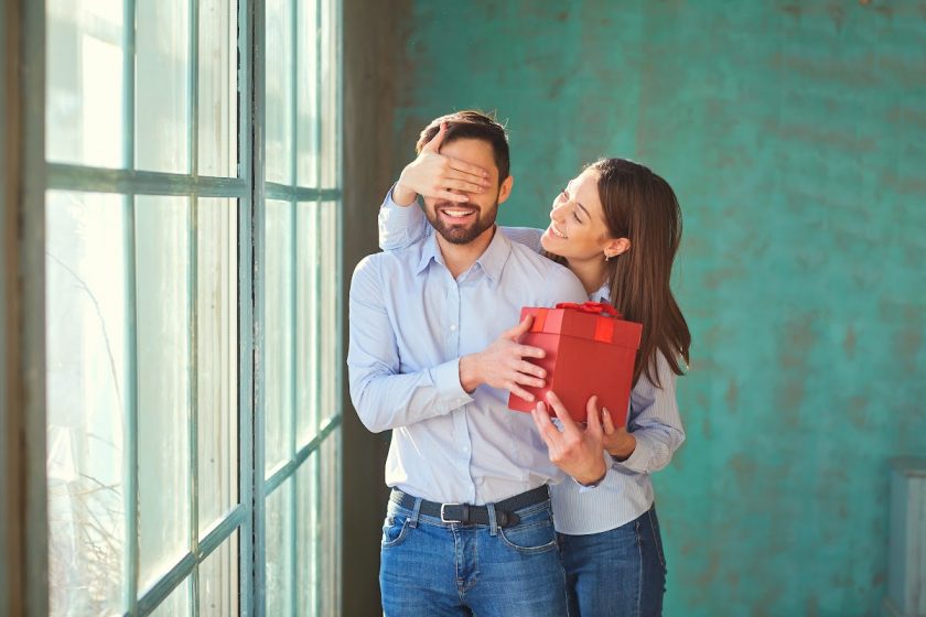 wife surprising minimalist husband with Christmas gift