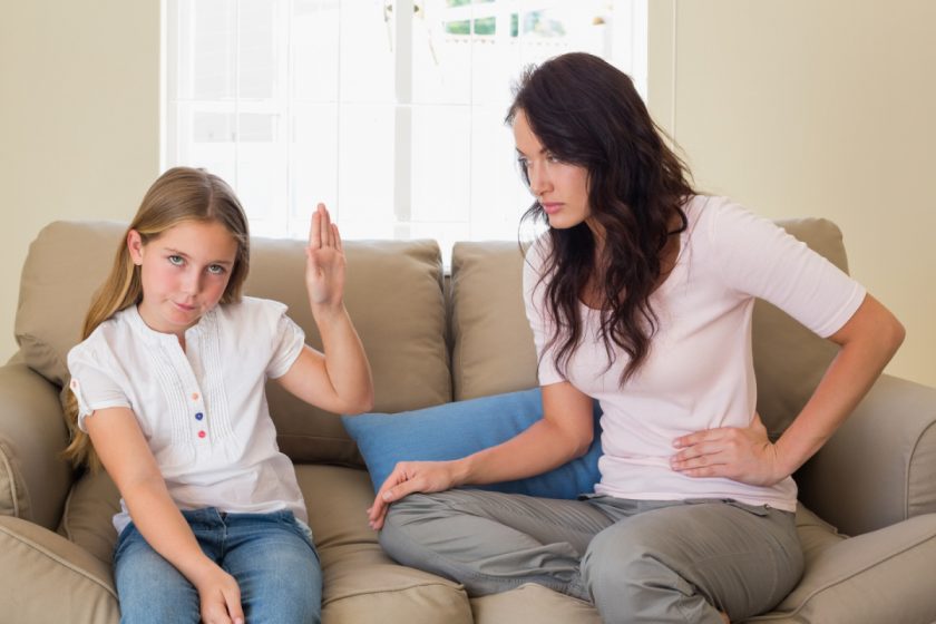 mom and daughter arguing on sofa