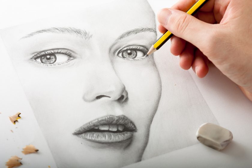 sketch artist drawing face with regular pencil