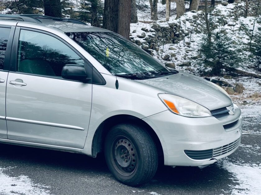 silver 2005 Toyota Sienna outside in driveway during winter