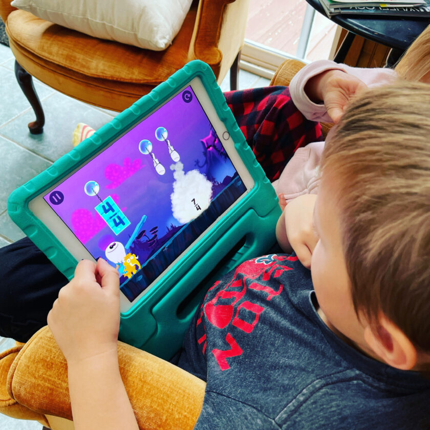Unschooled kids playing Slice Fractions on iPad