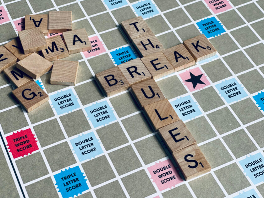 scrabble board with "break the rules" mesage