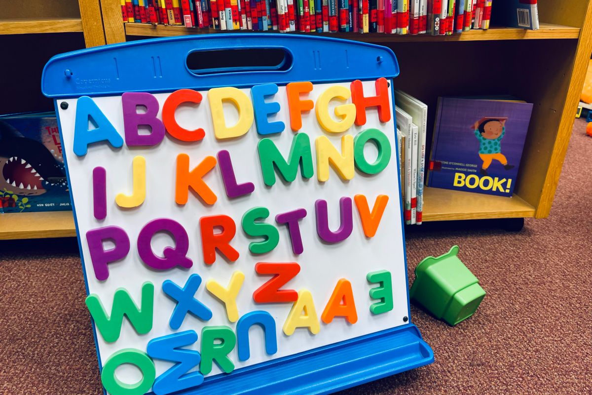 magnetic alphabet letters on white board in alphabetical order.