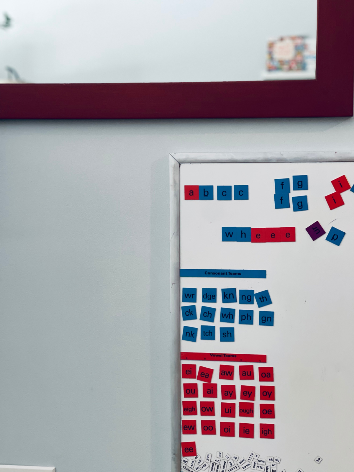 All About Spelling tiles, sitting unused on magnetic whiteboard