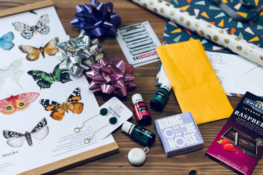 homeschool mom gifts and wrapping paper supplies spread out on table