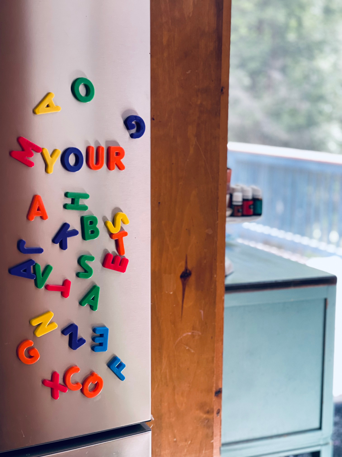 colorful letter magnets of refrigerator door