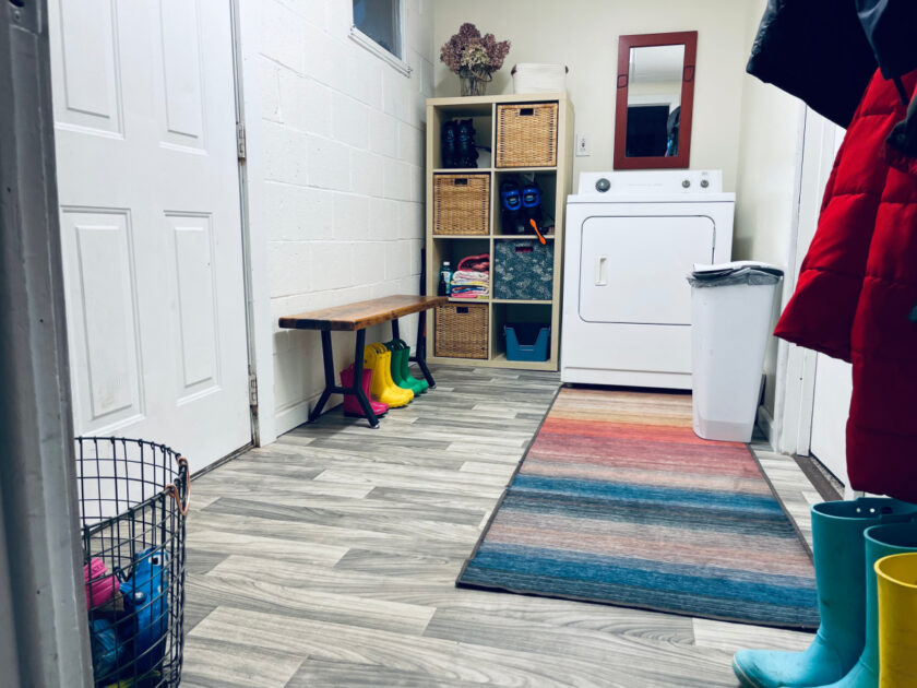 multicolored Ruggable rug runner in mudroom leading to dryer