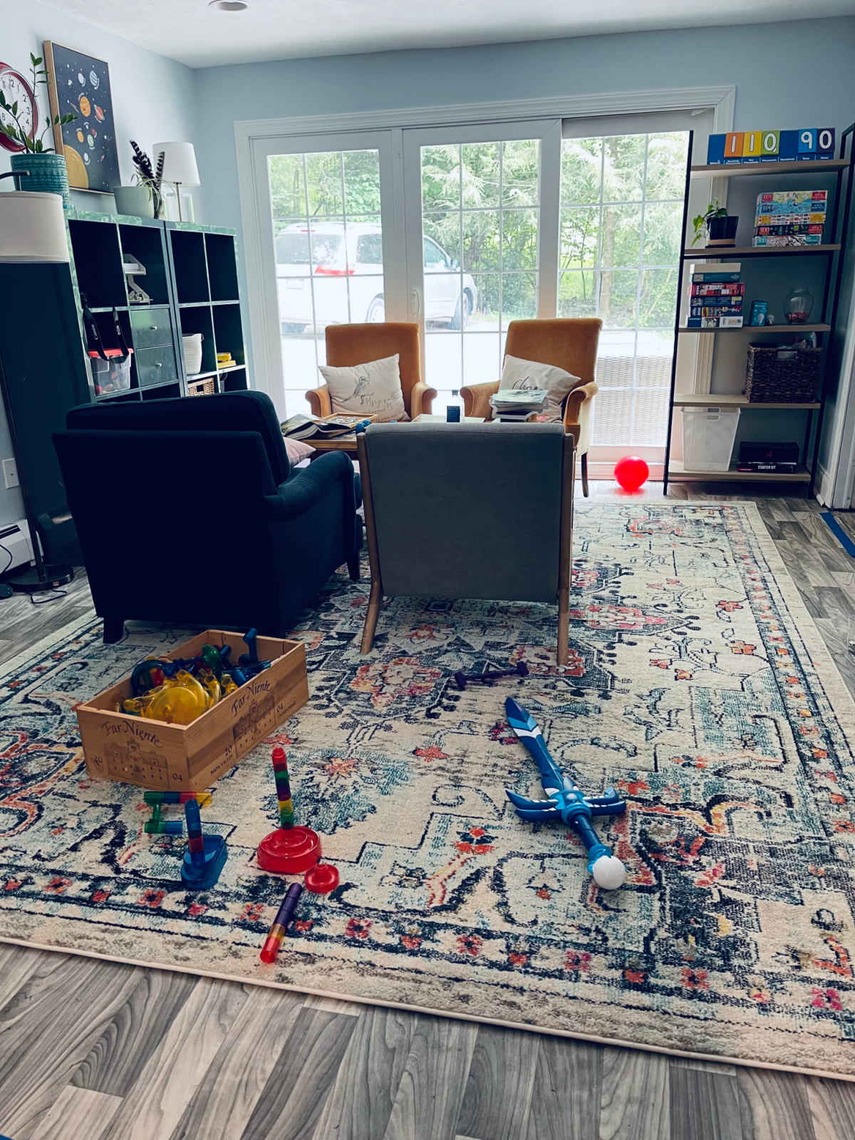 homeschool room with toys, comfy chairs and Safaveih rug - NOT a ruggable rug.