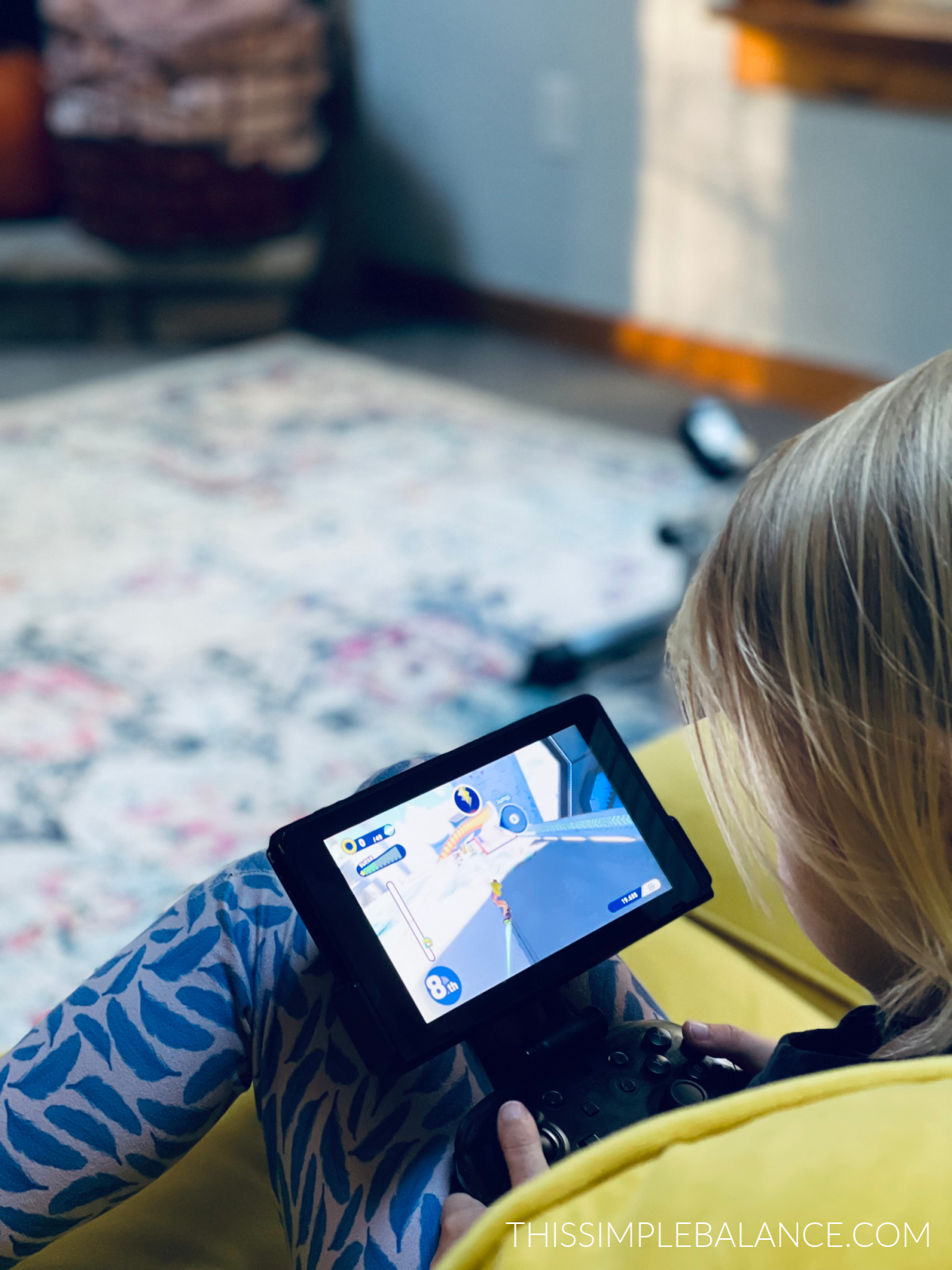 young child playing nintendo switch game.