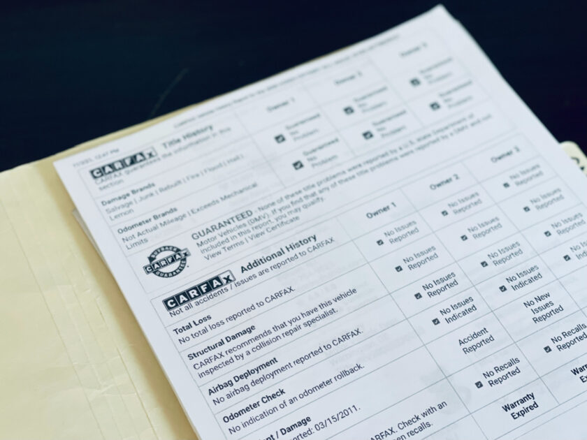 Car Fax report on used vehicle close up.